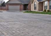 stamped concrete driveway and street in austin contractor example image