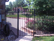 simple wrought iron fence and gate