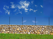 stone wall with wire top